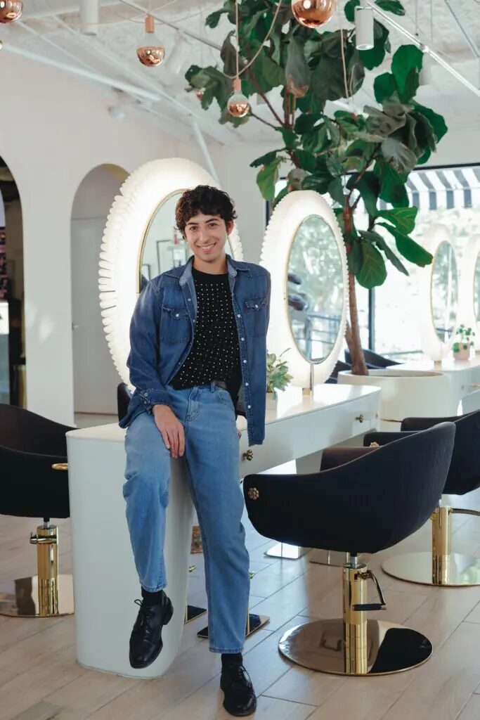 Daniel Martinez, hairstylist at Studio A Salon, standing in the salon