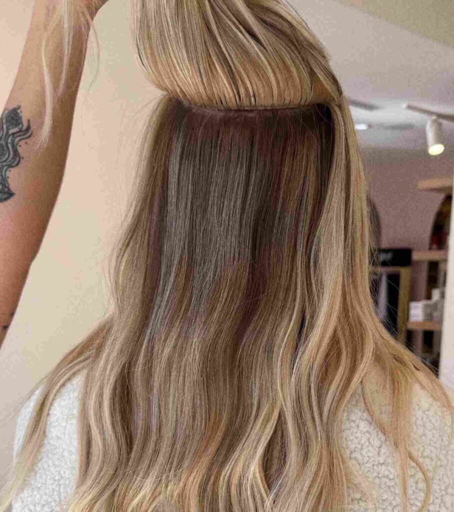 Seamless weft hair extension install at Studio A Salon in Houston